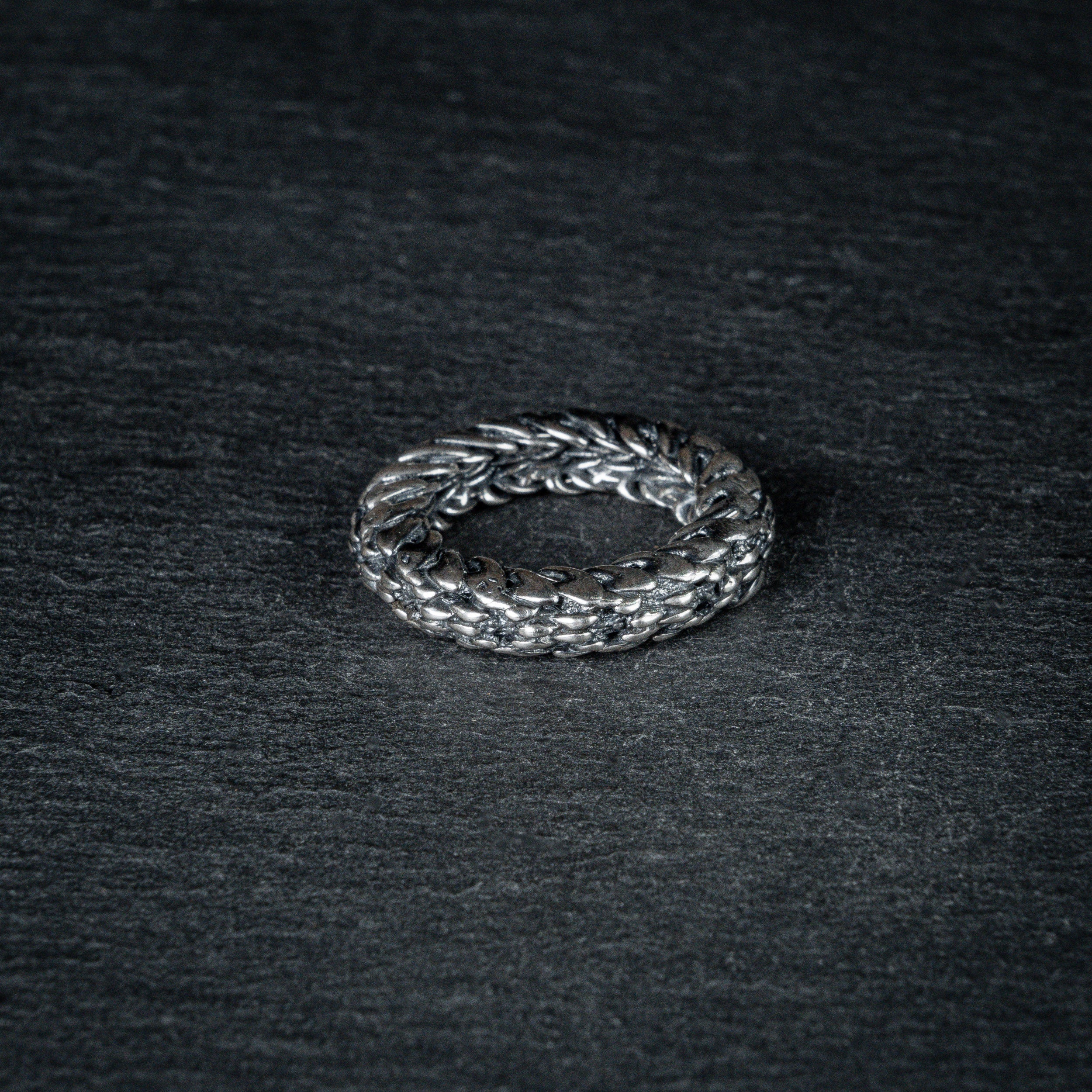 Sculptural silver ring 'FIBON' inspired by the Fibonacci sequence – featuring spiraling curves symbolizing growth and balance