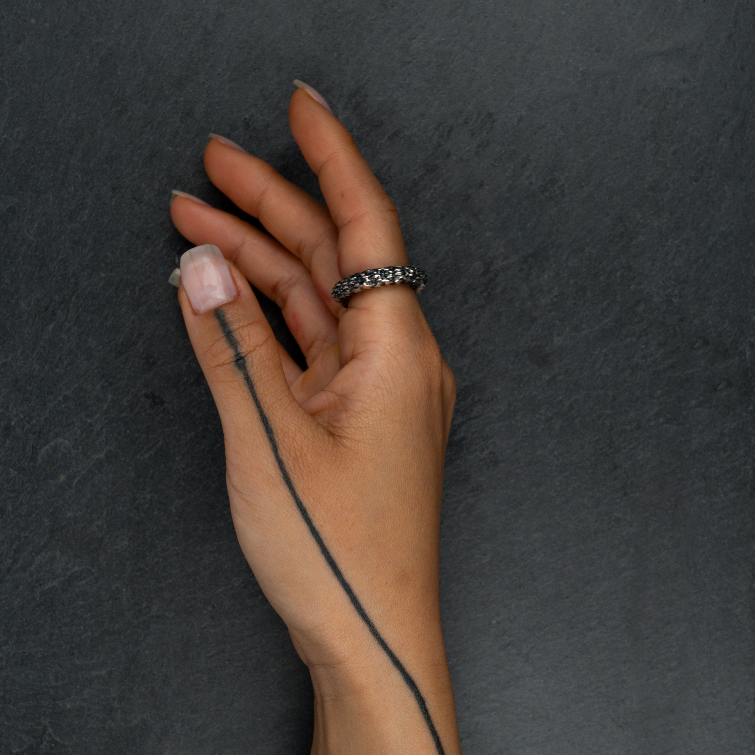 Silver ring 'FIBON' worn on hand – organic spiraling curves reflecting nature’s harmony and proportionality