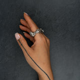 Sculptural silver ring 'KUILUUN' by Myon Rox – bold design with deep-set pattern and shadow effect, on hand