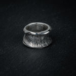 Back view of silver ring 'Talon' – open band and sculptural flow by Myon Rox
