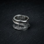 Sculptural silver ring 'Talon' by Myon Rox – fluid curves, waterfall-inspired texture, front view