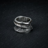 Sculptural silver ring 'Talon' by Myon Rox – fluid curves, waterfall-inspired texture, front view