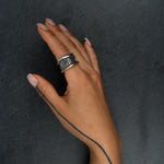 Contemporary silver ring 'Talon' – flowing lines and organic texture, worn on hand, back view