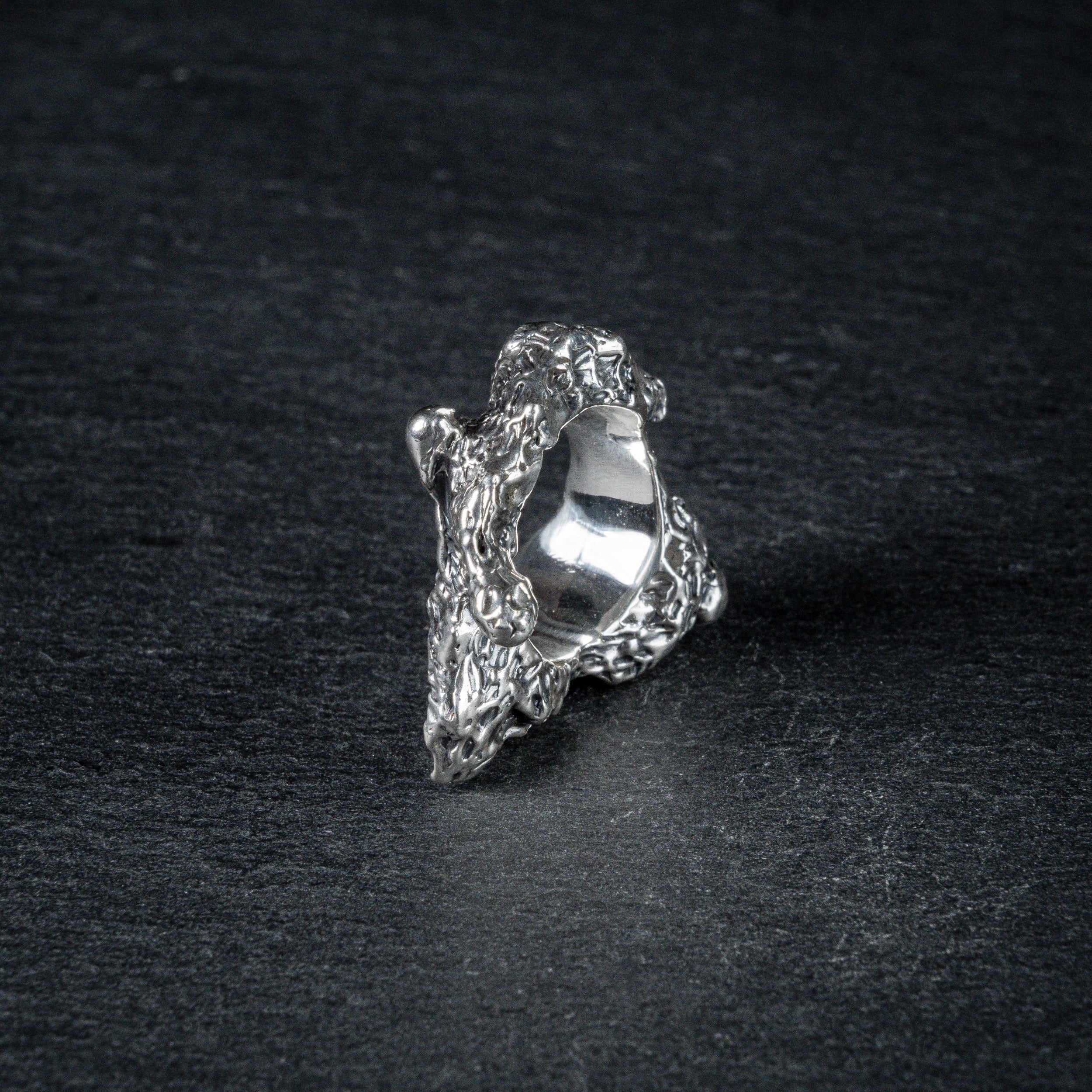 Sculptural oxidized silver ring 'Tephra' by Myon Rox – asymmetric open band, molten texture, unisex design, standing