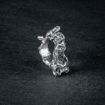Sculptural silver ring 'Tephra' by Myon Rox – asymmetric open band, molten texture, unisex design, front view