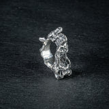 Sculptural silver ring 'Tephra' by Myon Rox – asymmetric open band, molten texture, unisex design, front view