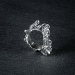 Sculptural silver ring 'Tephra' by Myon Rox – asymmetric open band, molten texture, unisex design, side view