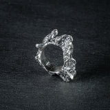 Sculptural silver ring 'Tephra' by Myon Rox – asymmetric open band, molten texture, unisex design, side view