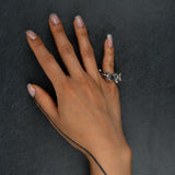 Sculptural silver ring 'Tephra' by Myon Rox – asymmetric open band, molten texture, unisex design, on hand upwards