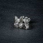 Sculptural silver ring 'KUILUUN' by Myon Rox – bold design with deep-set pattern and shadow effect
