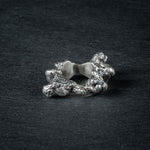 Side view of silver ring 'KUILUUN' – dramatic, abyss-inspired design with shadowed inner structure
