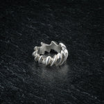 ASCEY silver sculptural ring with bold jagged spine design on dark slate, top viewASCEY silver sculptural ring with bold jagged spine design on dark slate, top view