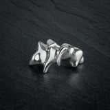 SYRINX organic massive silver sculptural statement ring on dark slate, front view